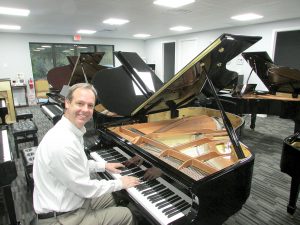 Picarzo Pianos Owner Michael Pratt at Piano